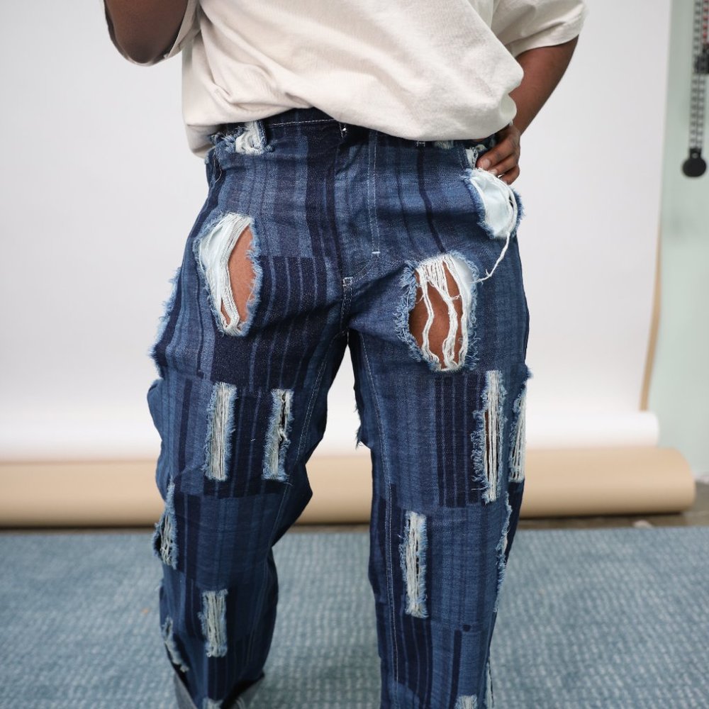 CHARLES JEFFREY BAGGY JEANS WITH ALL OVER RIPS